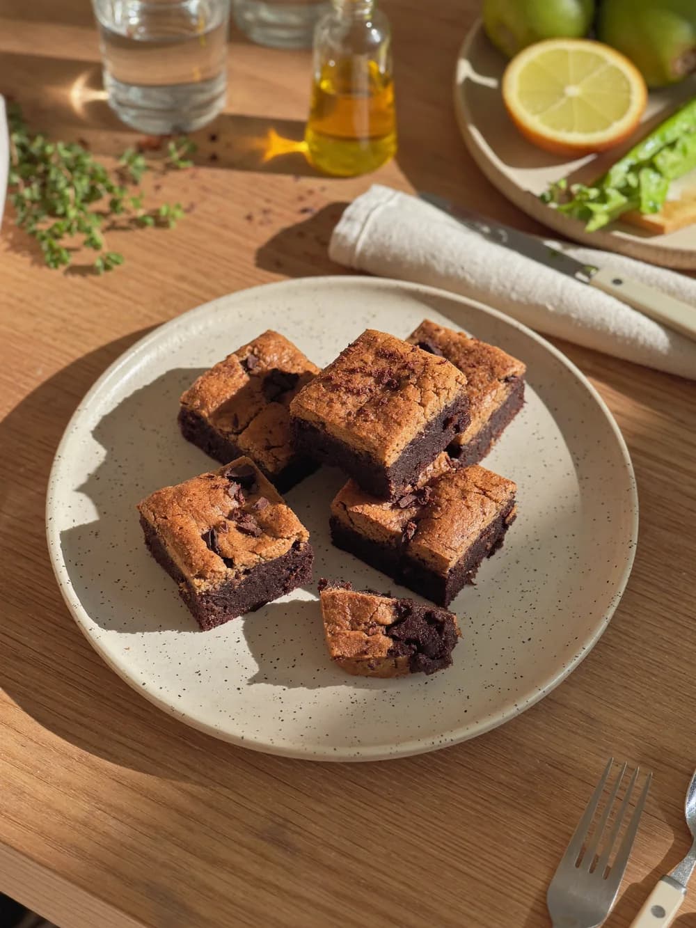 Fudgy chocolate-chunk black bean brownies on a speckled plate